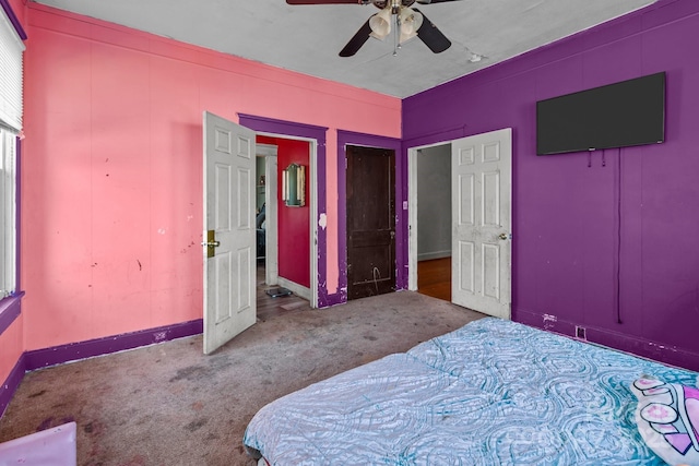 bedroom with baseboards, ceiling fan, and carpet floors