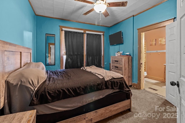 carpeted bedroom with connected bathroom and a ceiling fan