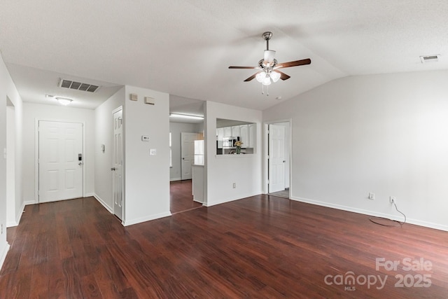 unfurnished living room featuring wood finished floors, visible vents, and ceiling fan