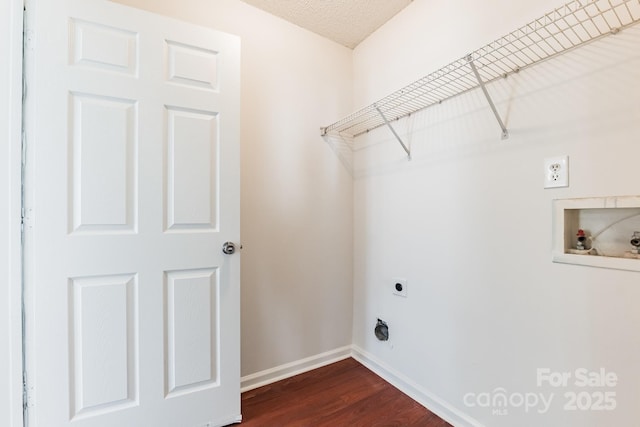 clothes washing area featuring electric dryer hookup, laundry area, baseboards, hookup for a washing machine, and dark wood-style flooring