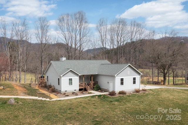 155 Parker Rd, Asheville, NC 28805 - view of front facade featuring a front yard, a forest view, a shingled roof, and crawl space