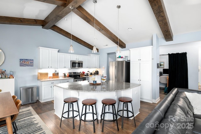 155 Parker Rd, Asheville, NC 28805 - kitchen with open floor plan, white cabinets, light stone countertops, a breakfast bar area, and stainless steel appliances
