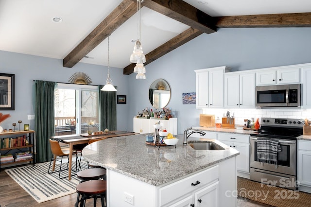 155 Parker Rd, Asheville, NC 28805 - kitchen with a sink, appliances with stainless steel finishes, an island with sink, backsplash, and light stone counters