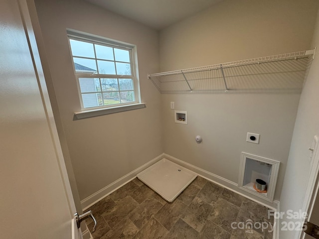 laundry area with hookup for a washing machine, baseboards, laundry area, electric dryer hookup, and hookup for a gas dryer