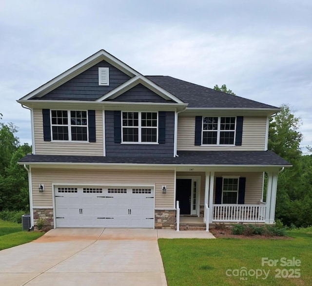145 High Rock Ct Unit 03, Statesville, NC 28677 - view of front of home featuring covered porch, driveway, central air condition unit, a garage, and stone siding