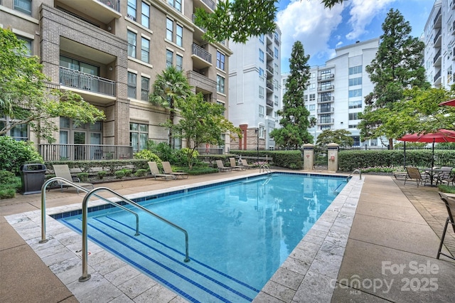 community pool with a patio area