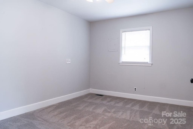 unfurnished room with carpet, baseboards, and visible vents