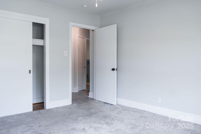 unfurnished bedroom with carpet and baseboards