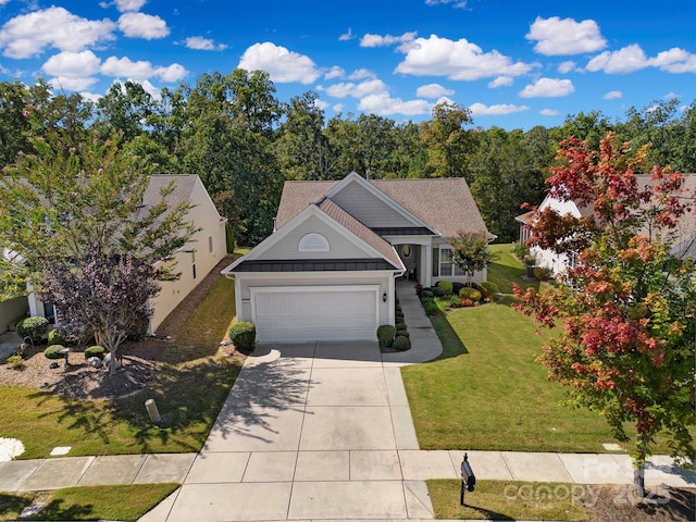 view of front of house with a garage, driveway, a front lawn, and roof with shingles