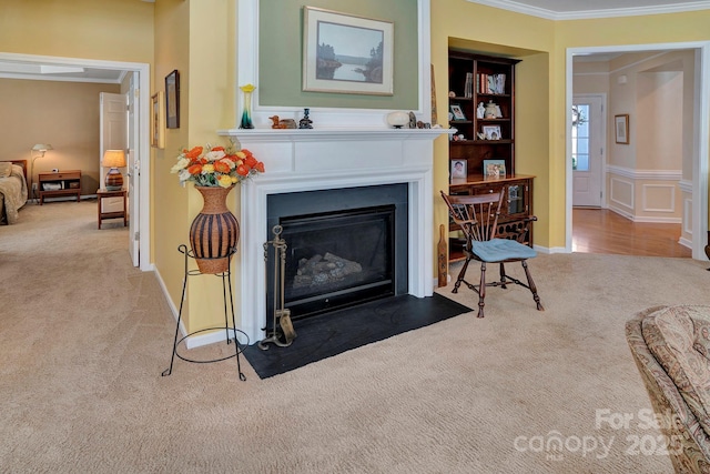 carpeted living room with a fireplace with flush hearth, built in features, and ornamental molding