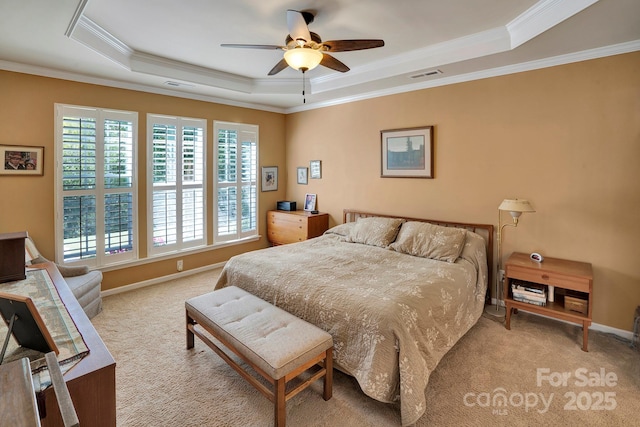 bedroom with visible vents, carpet flooring, a raised ceiling, and ornamental molding