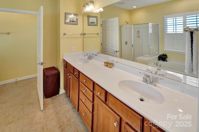 full bath featuring tile patterned floors, a shower stall, double vanity, and a sink