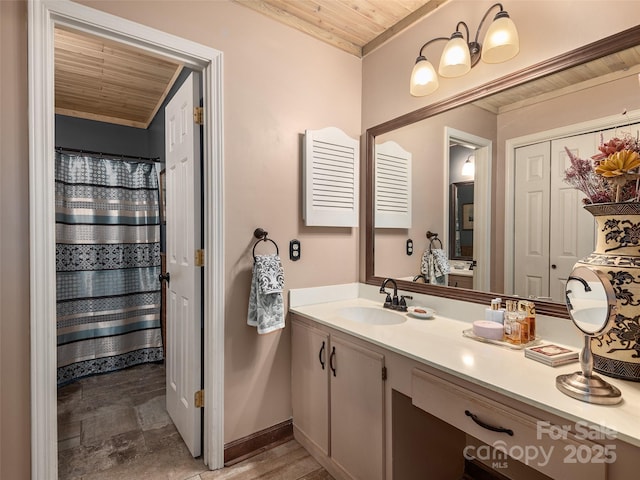 full bathroom with vanity, wood ceiling, and baseboards