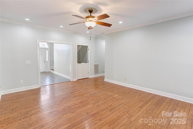 unfurnished room featuring crown molding, a ceiling fan, and light wood finished floors