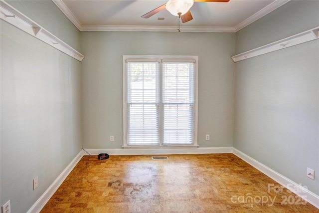 unfurnished room with a ceiling fan, a wealth of natural light, and ornamental molding