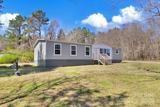 view of front facade with crawl space and a front lawn