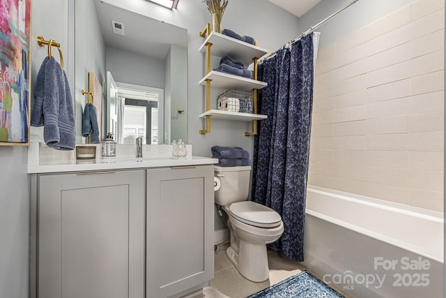 bathroom featuring vanity, shower / tub combo, toilet, and visible vents