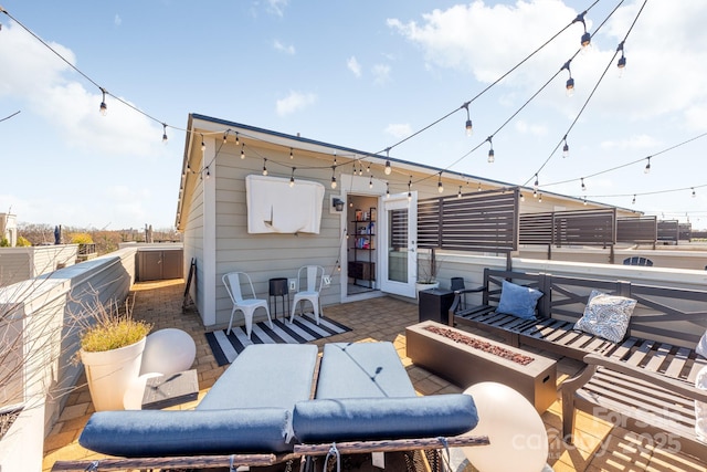 view of patio / terrace featuring an outdoor fire pit