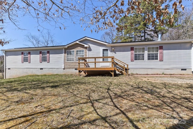 view of front of property with a front lawn, crawl space, and a deck