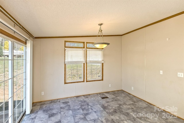 unfurnished room featuring a textured ceiling and crown molding