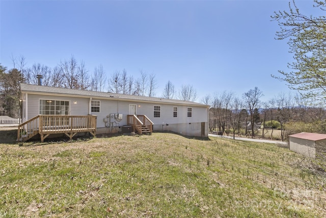 back of house featuring a lawn, cooling unit, a wooden deck, and crawl space
