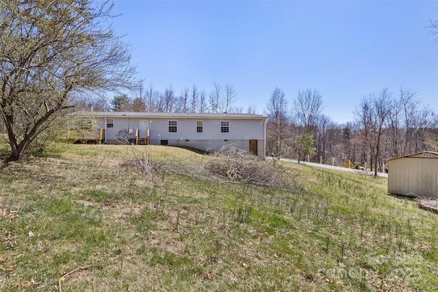 rear view of property featuring a deck