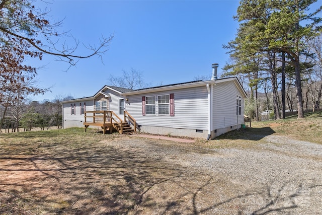 manufactured / mobile home with crawl space and a deck
