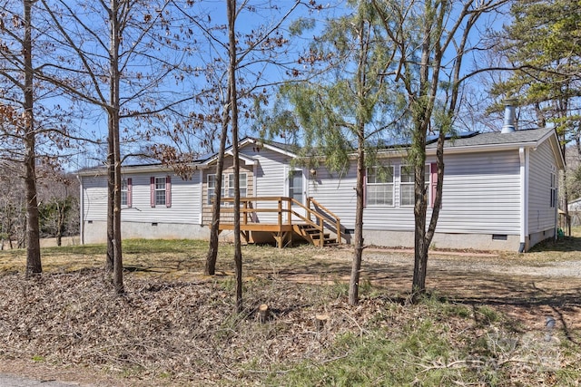 manufactured / mobile home featuring crawl space and a wooden deck