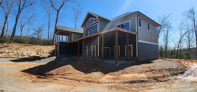 rear view of house featuring a patio