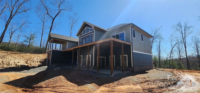 view of property exterior featuring a patio area