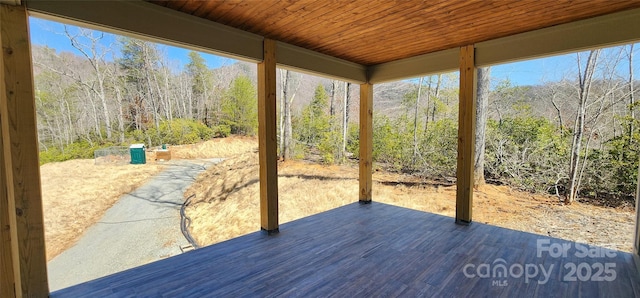 wooden terrace featuring a patio