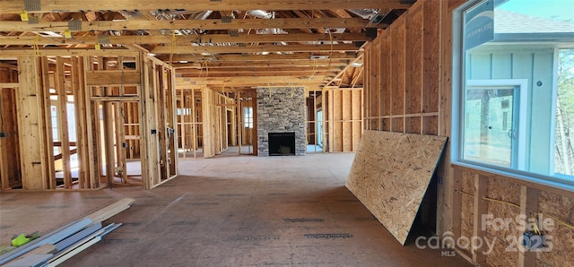 misc room with a stone fireplace