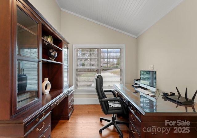 office space with light wood-style flooring, baseboards, crown molding, and lofted ceiling