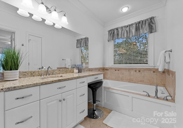 bathroom with a bath, tile patterned floors, vanity, and crown molding