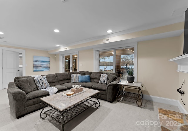 living room featuring light colored carpet, visible vents, recessed lighting, and baseboards