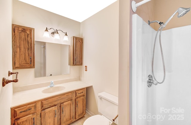 bathroom with a shower, toilet, and vanity