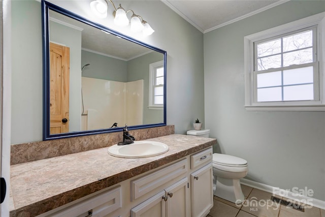 bathroom with tile patterned floors, vanity, toilet, and crown molding