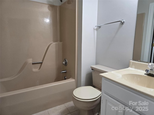 full bathroom with tile patterned floors, toilet, vanity, and shower / bath combination