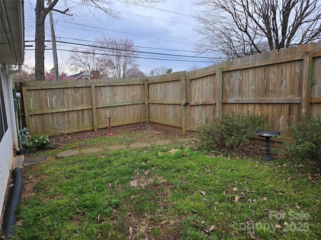 view of yard featuring a fenced backyard