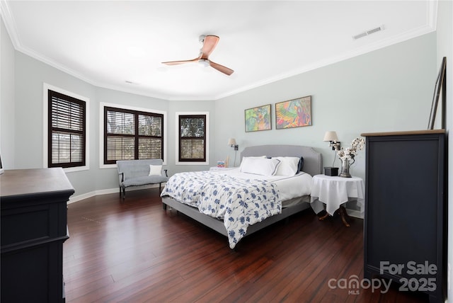 bedroom with visible vents, baseboards, ceiling fan, dark wood finished floors, and ornamental molding