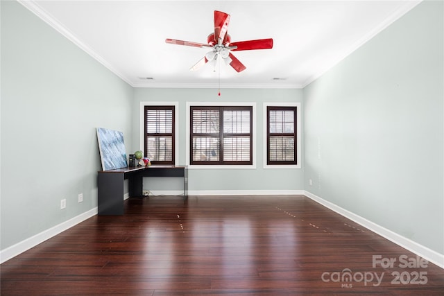 spare room with a ceiling fan, wood finished floors, baseboards, and ornamental molding