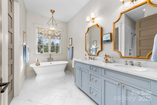 68 Cinch Knot Dr, Nebo, NC 28761 - bathroom with a shower, double vanity, a freestanding bath, marble finish floors, and baseboards
