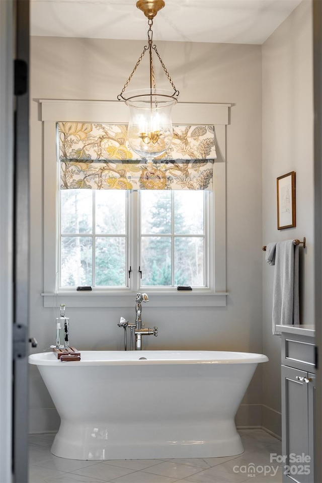 68 Cinch Knot Dr, Nebo, NC 28761 - full bathroom with plenty of natural light, a soaking tub, and baseboards