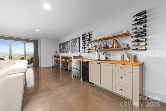 68 Cinch Knot Dr, Nebo, NC 28761 - indoor wet bar featuring concrete flooring, recessed lighting, fridge, and baseboards
