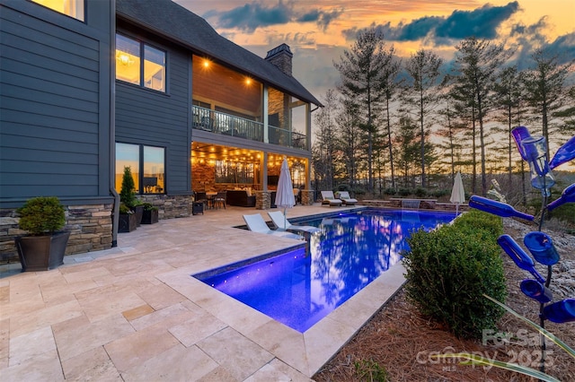 68 Cinch Knot Dr, Nebo, NC 28761 - pool at dusk with a patio area and an outdoor living space