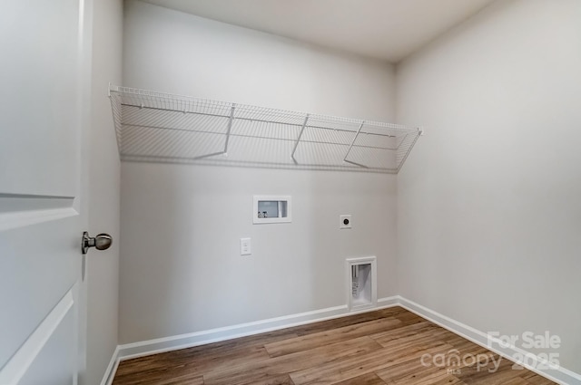 laundry room with electric dryer hookup, wood finished floors, hookup for a washing machine, and laundry area