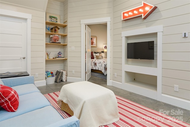 bedroom with wood walls