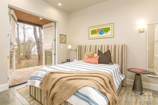 bedroom featuring access to exterior, recessed lighting, and baseboards