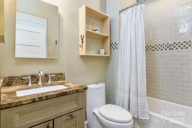 bathroom with toilet, shower / bath combo, and vanity