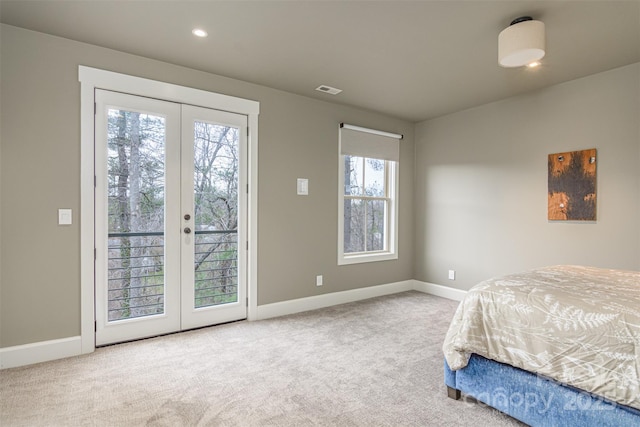 carpeted bedroom featuring access to exterior, visible vents, baseboards, recessed lighting, and french doors